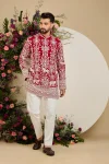 Red short kurta with tropical flora and fauna embroidery, ivory threadwork, and delicate sequin detailing for refined occasion wear